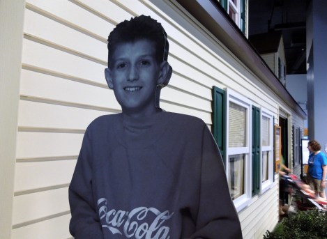 Ryan White in front of the replica of his house